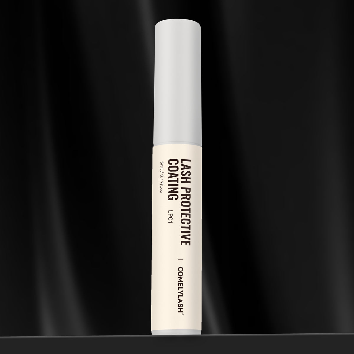 COMELYLASH lash protective coating bottle on a black background