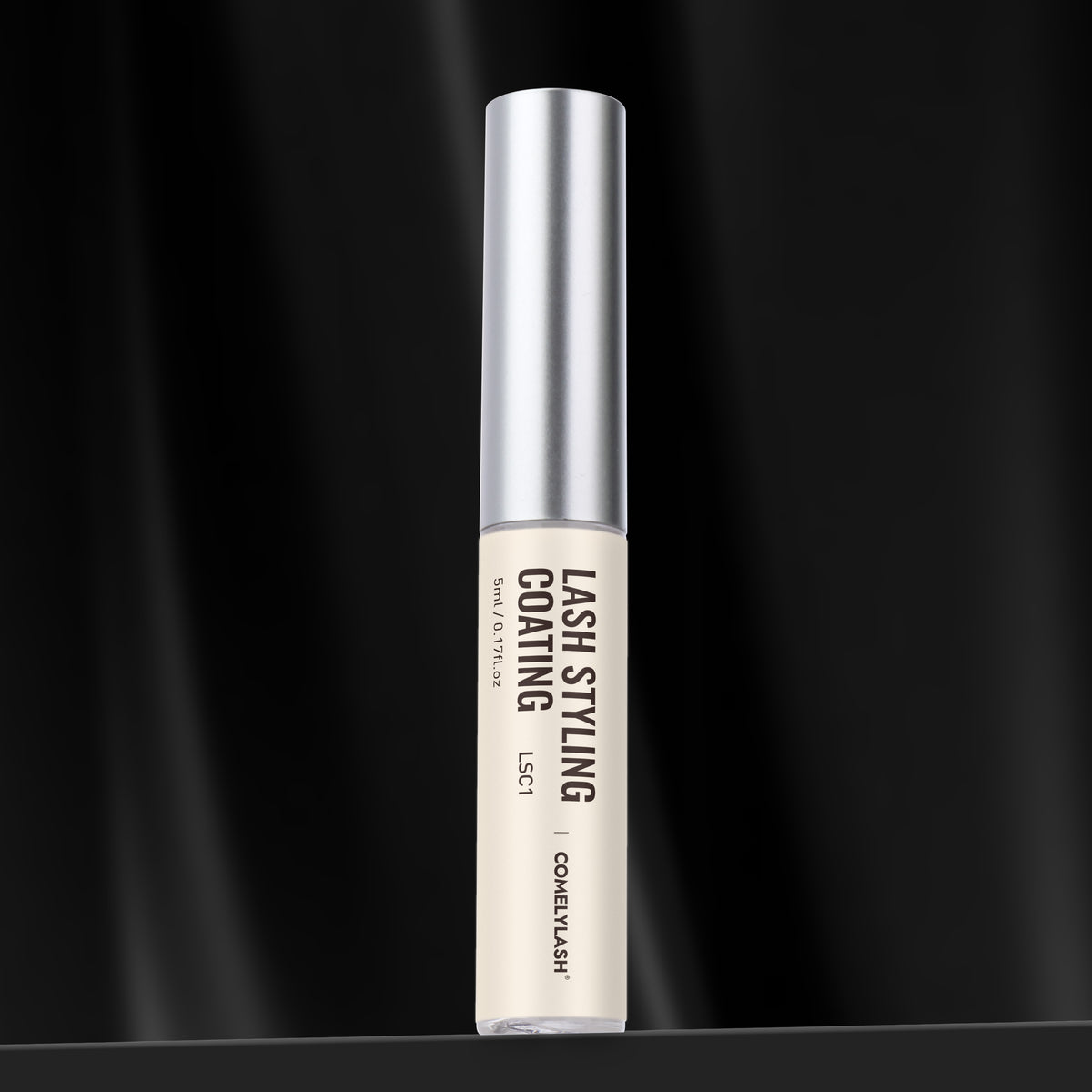 COMELYLASH lash styling coating bottle on a black background