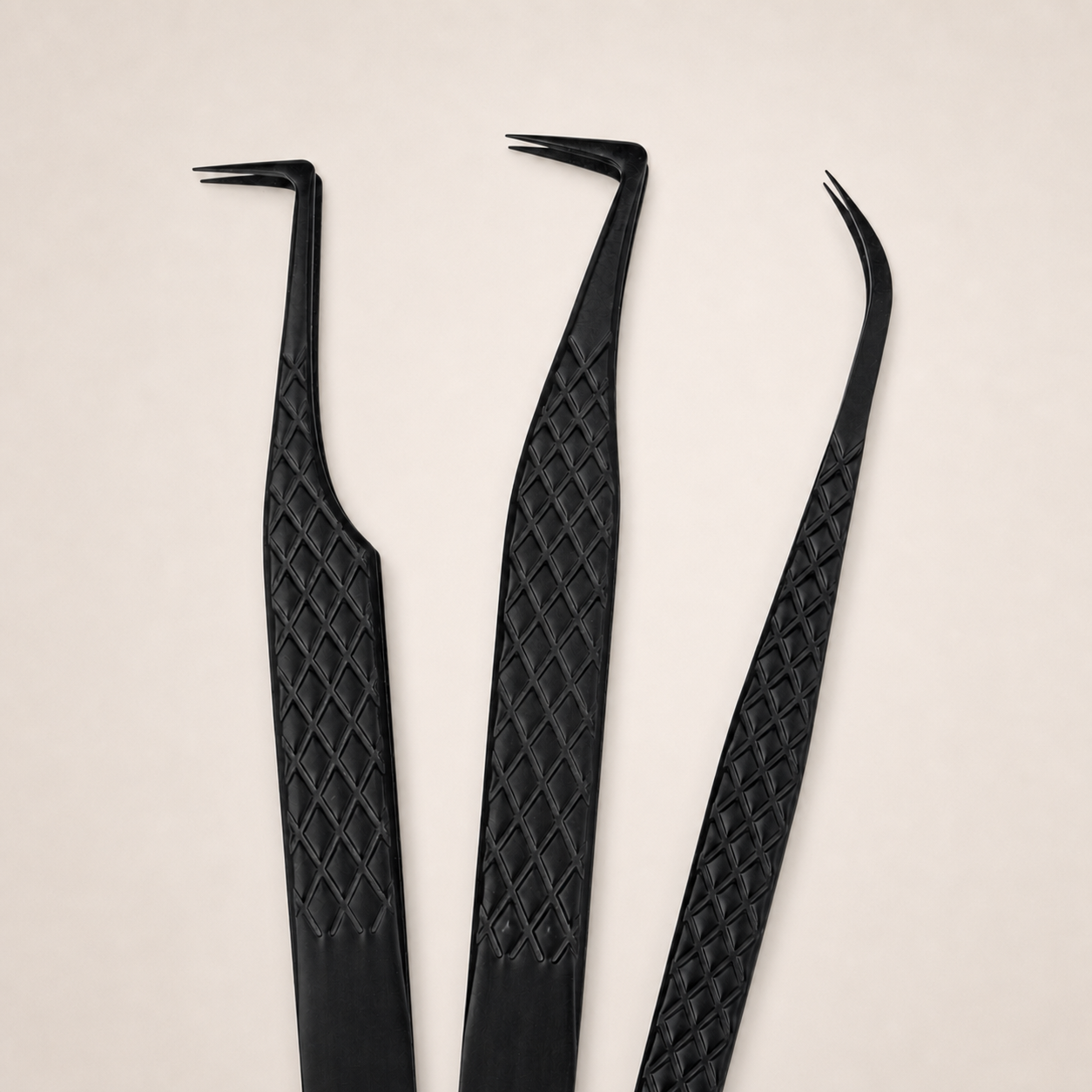 Three matte black professional eyelash tweezers